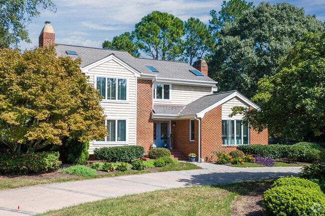 A large single-family home in Linkhorn Park features mature landscaping and privacy.