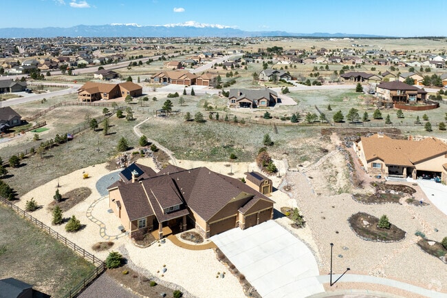 There are homes on large lots of land in the Falcon neighborhood.