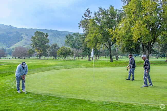 Golfers line up a putt at Santa Teresa Golf Club, just minutes from homes in Chantillery.
