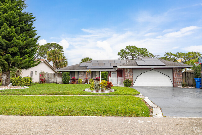 A Lone Pines ranch home embraced by lush, meticulously groomed landscaping.