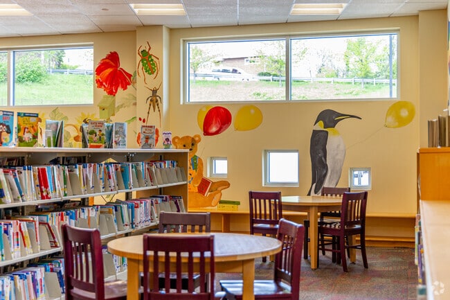 The Penn Hills Community Library includes a childrens section with tables and murals.