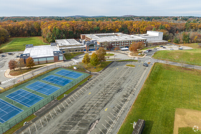 Ample parking along with tennis courts and sports fields at Andover High School in Andover, MA.
