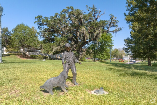Geri Moulton Children’s Park features lifelike statues along shaded walking paths.