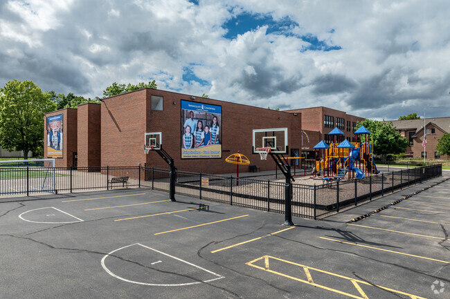 There are basketball hoops outside Immaculate Conception Catholic School
