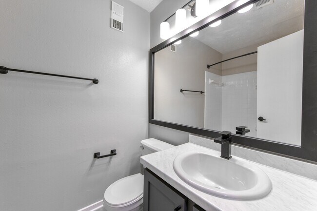 Bathroom with upgraded fixtures, lighting and hardware