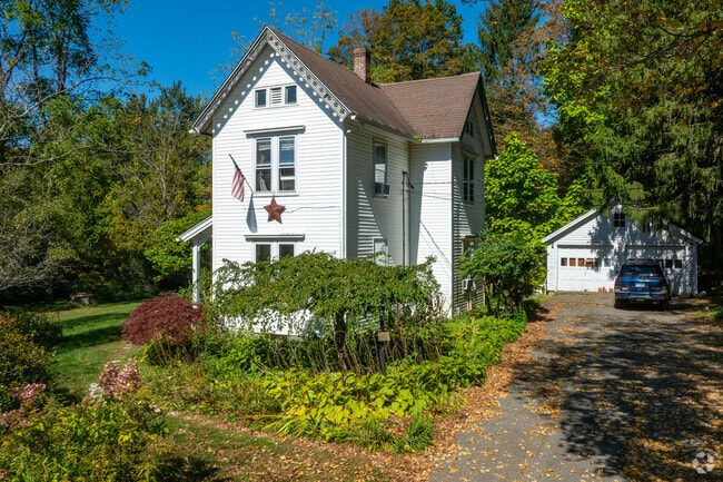 A historic home in Bethlehem surrounded with lush greenery.