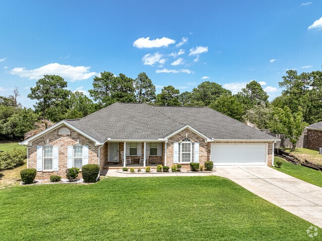 A brick bungalow home in Belair with a generous garage and front yard.