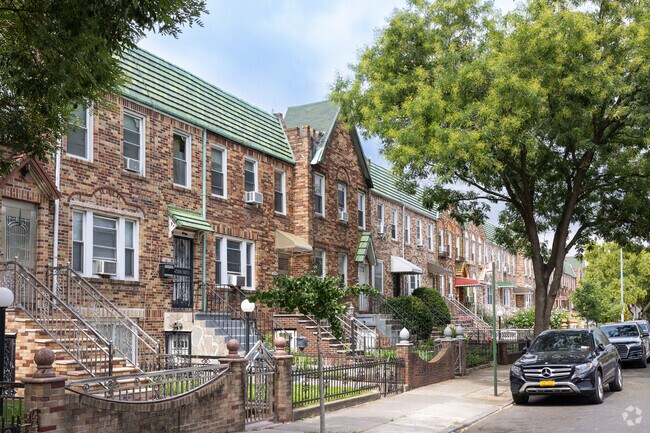 Brick townhouses stand side by side in vibrant East Flatbush.