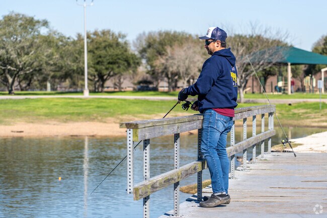 A fisherman casts a line at Burke Crenshaw Park, located in Pasadena.