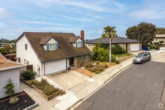 Ranch-style house with red tile roof in Redwood Village.