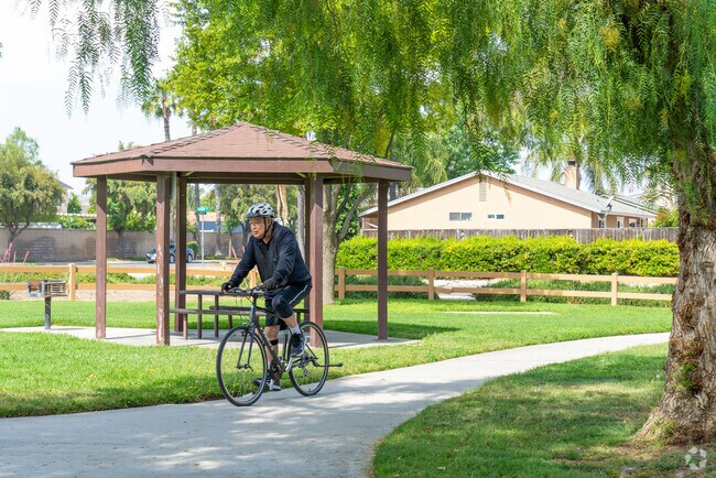 Ride bicycles on scenic trails at E. L. Pete Petersen Park in Quail Valley.