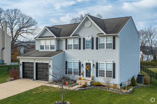 Large two-story traditional homes sit in neighborhoods with large lots in Newberry Township.