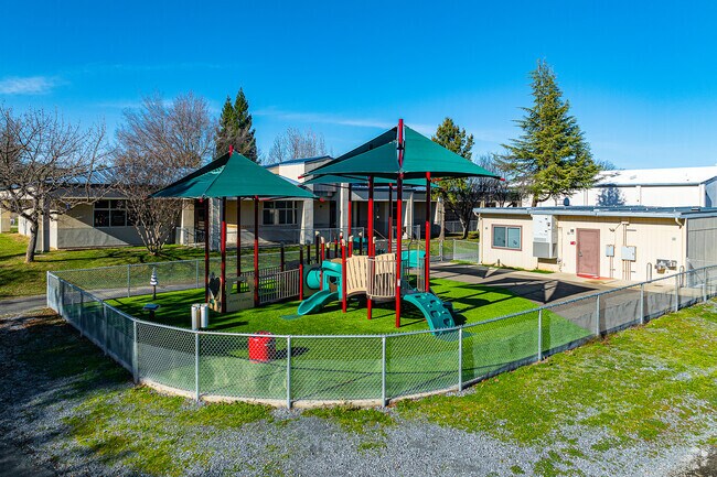 The young children love the small play structure at Northside Elementary School .
