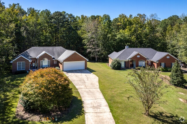 Piney Grove homes tend to sit on one acre lots with long driveways.