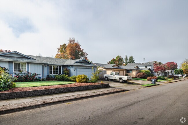 A pair of single-story ranch homes in Thurston reflect mid-century suburban charm.