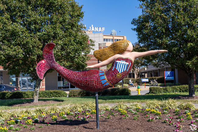 One of the many mermaid sculptures of Norfolk points to Janaf Shopping Center near Crown Point.
