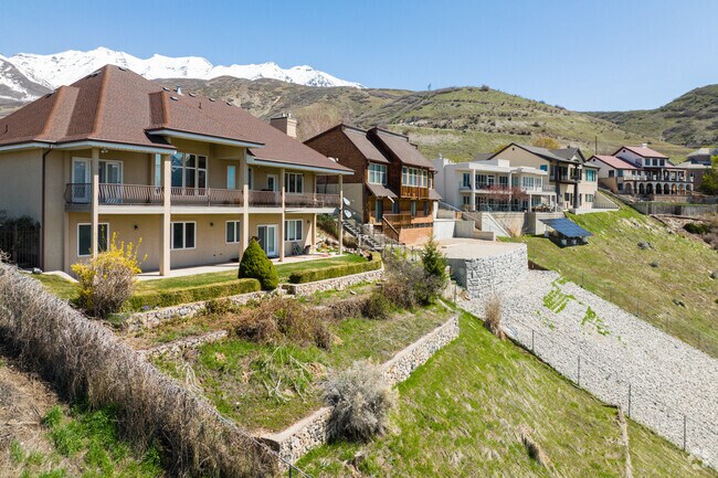 A row of homes on a cliffside in Northridge offers stunning views of the surrounding mountains and cityscape.