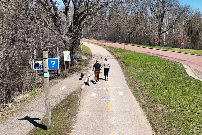 A couple enjoying the paved trails at Theodore Wirth Park.