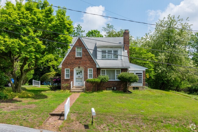 Small brick homes with charming architecture boast large yards in Enhaut.
