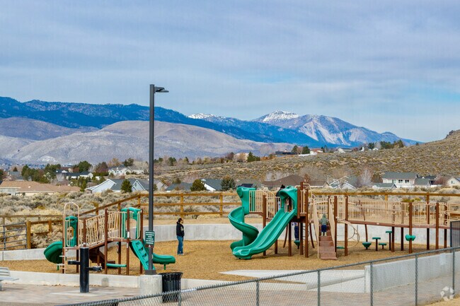 Children enjoy the playground at Johnson Lane Park under sunny skies.