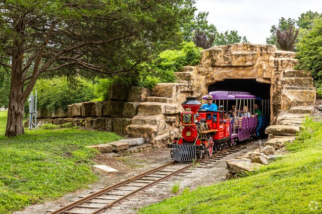 The Gage Park Mini-Train weaves its way through the park tarain and tunnels.