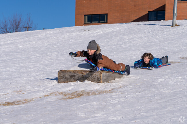 Williamsburg’s winter wonderland is perfect for kids sliding in the snow.