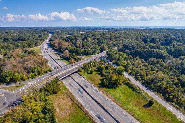 Bustling section of Madison where Interstate 95 runs parallel to vibrant tree lined streets.
