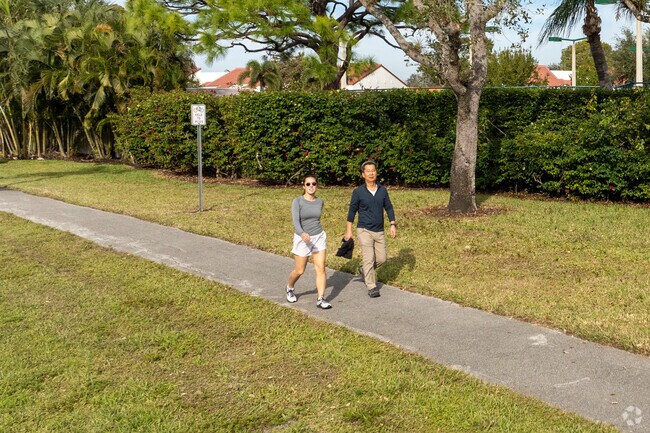 Pelican Bay residents enjoy getting out for a walk on it's many walking paths and sidewalks.