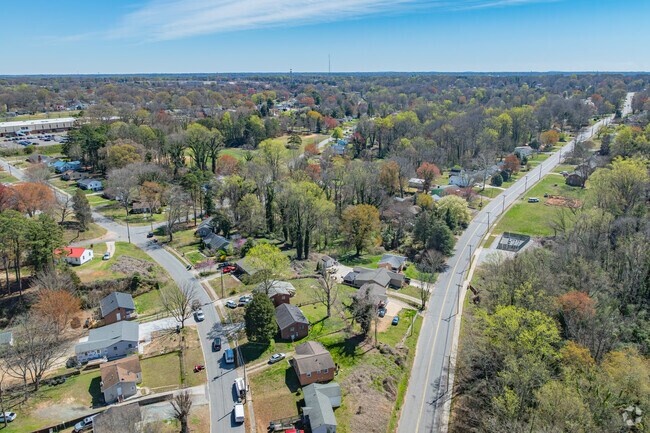 Konnoak is surrounded by large mature trees.