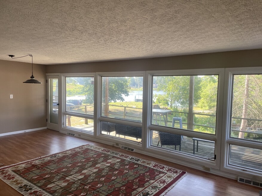 donning room to deck with walk down to lake