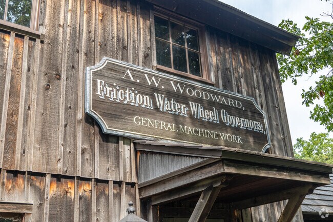 Rustic outbuildings in Midway Village offer tours all day near Bello Reserve.