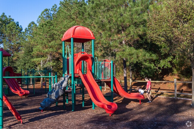 Children's laughter fills the air at the playgrounds of Spanish Fort Town Center Park.