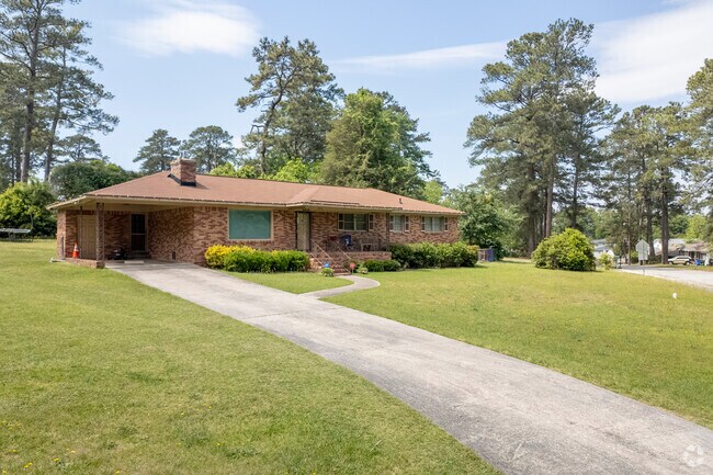 Open carports are a common feature for parking at homes throughout Greenview.