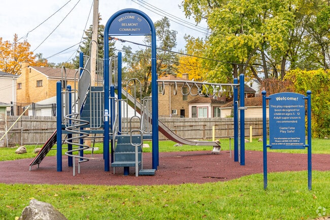 Neighborhood kids enjoy the playground facilities at Puritan-Coyle Park and a swing set.
