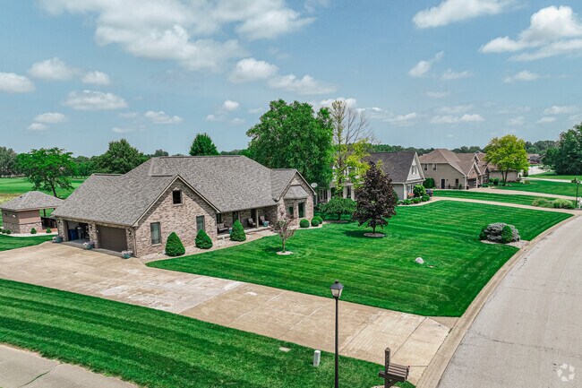 Houses West of Berkley have young trees and fresh landscaping, in Westbrook.