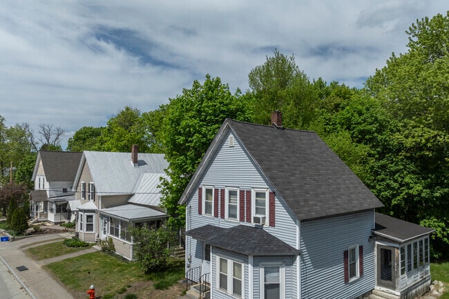 A row of homes in Concord reflects timeless neighborhood charm, with well-kept exteriors and a strong sense of community.