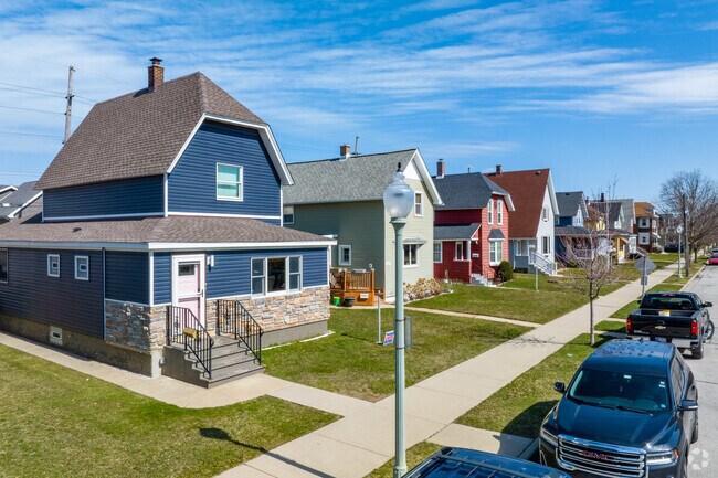 Various styles of houses line a quiet street in Whiting.