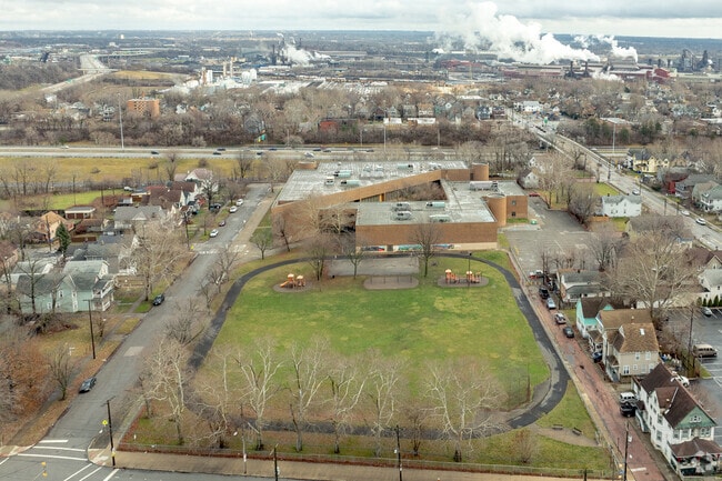 Aerial view of Luis Muñoz Marin Dual Language Academy with industry in the background.