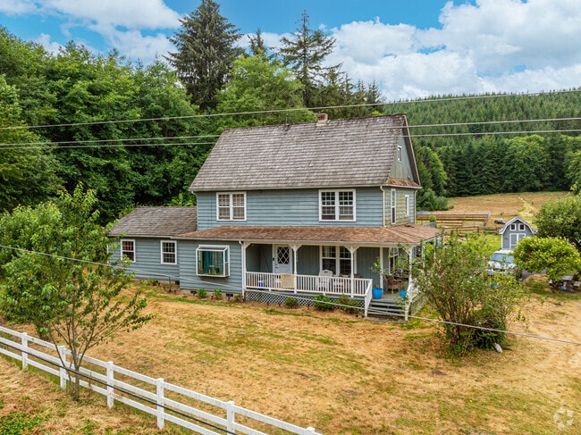 A beautiful baby blue farmhouse style home in the Aberdeen Gardens neighborhood.