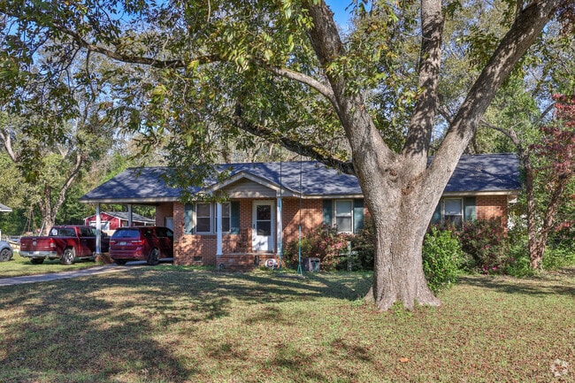 Ranch homes with trees and porch swings demonstrate the quiet feel of Dalzell.