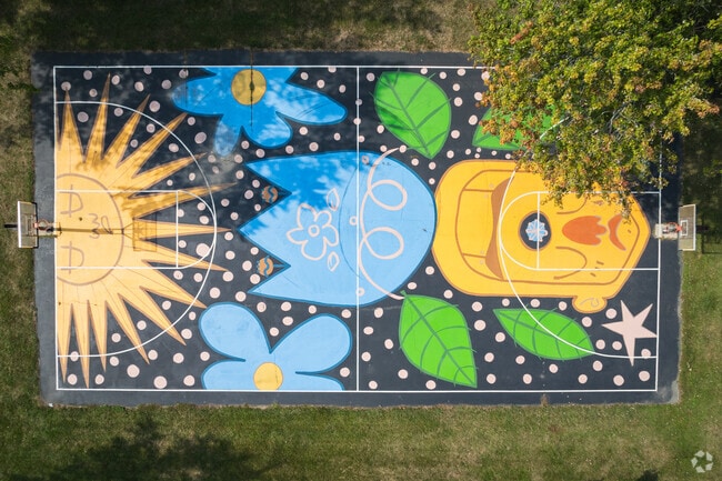 Hellenberg Park features a beautifully painted basketball court along the River Raisin.