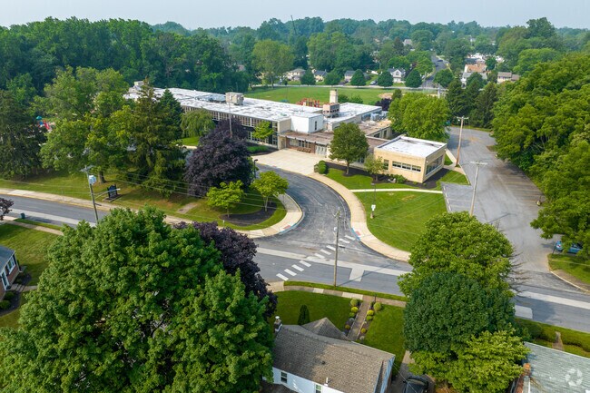 Worrall Elementary School sits among colonial and Cape Cod-style houses.