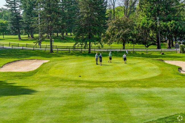Locals can catch a morning tee time at the Meadia Heights golf course.