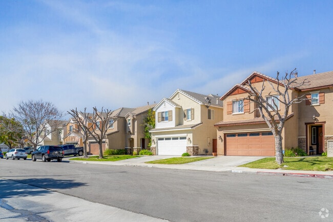 Row of two-story modern homes in North Perris offers sleek, contemporary designs with spacious layouts, perfect for comfortable living in a growing, vibrant community.