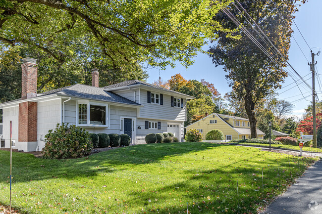 Charming colonial homes line the peaceful streets of Coleytown, blending history and elegance.