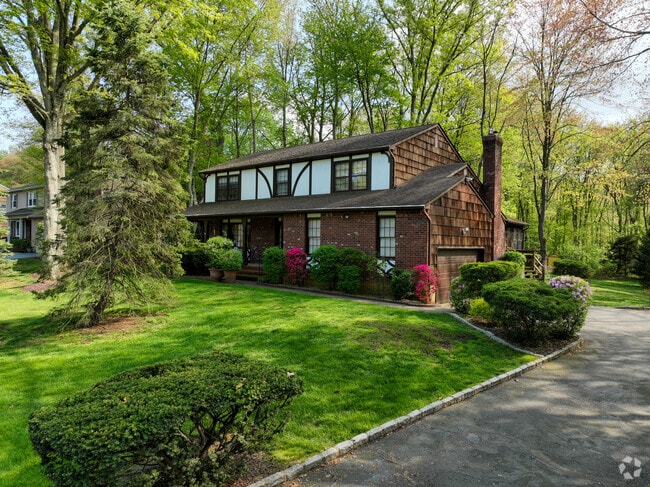 Homes with tudor style architecture can be found tucked away in the woods in Middletown