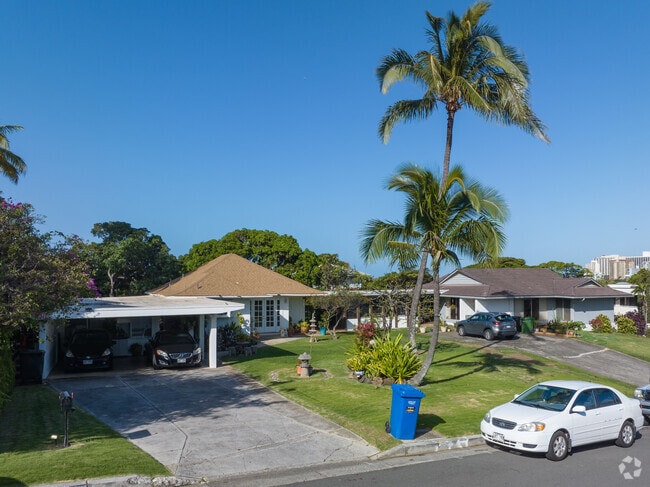 Carports provide shade to vehicles at single family homes in Diamond Head-Kapahulu-St Louis