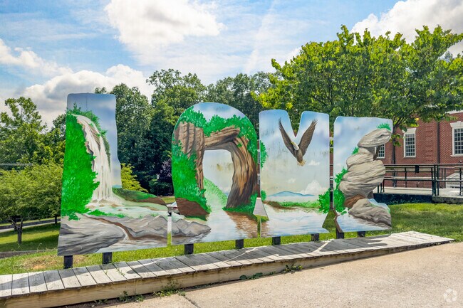 Natural Bridge draws visitors for landmark sightseeing and photo opportunities at the iconic LOVE sculpture.