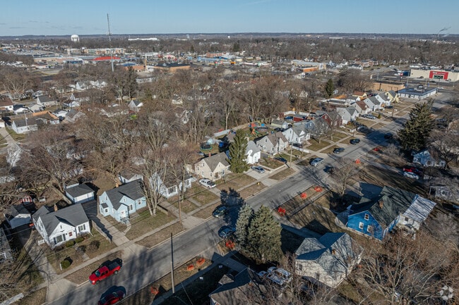 Small 20th century homes sit snuggly along gridded, sidewalk-lined streets in Clyde Park.