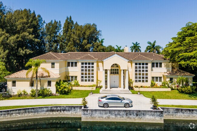 A large, well-kept traditional side-gabled ranch home in Royal Palm Trail.